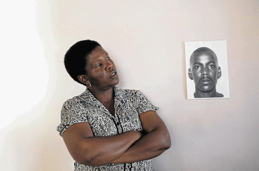 SLOW GRIND: Sidwel Mkwambi's sister, Nopinki, is relieved that the police members who allegedly caused his death will finally be charged, but bemoans the slow pace of the investigation into his death Picture: ESA ALEXANDER