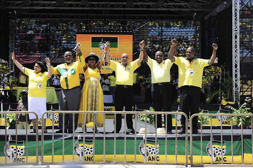 ANC's top 6 leaders, Jessy Duarte, Gwede Mantashe,Baleka Mbete, President Jacob Zuma, Cyril Ramaphosa and Zweli Mkhize greeting supporters at the Royal Bafokeng Stadium during the organization's 104th birthday celebrations. Photo Thulani Mbele.