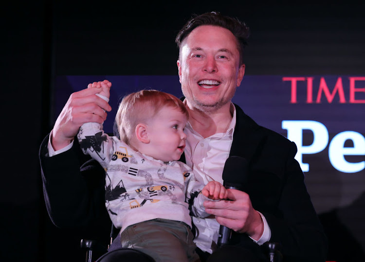 Elon Musk and son X Æ A-12 on stage at the Time Person of the Year function on December 13 2021 in New York City.