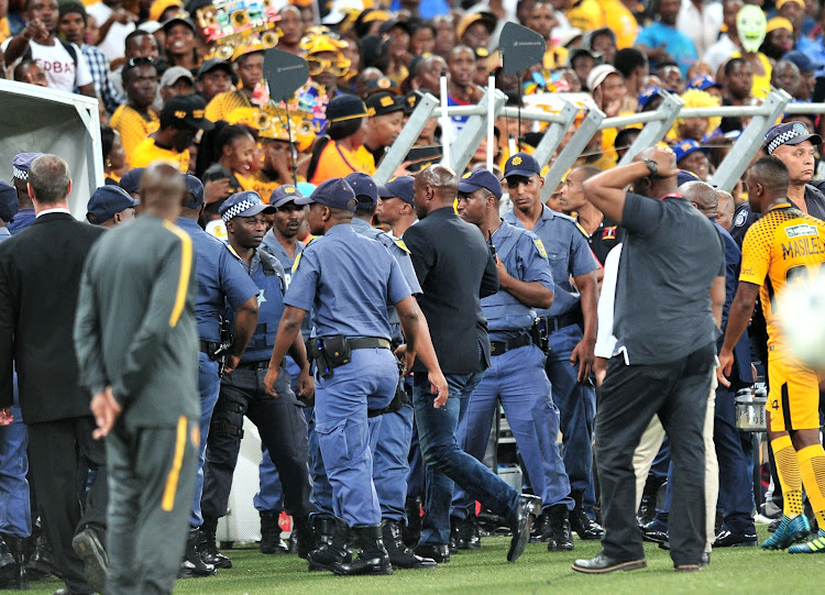 Kaizer Chiefs head coach Steve Komphela leaves the pitch after his team bombed out of the Nedbank Cup on Saturday.