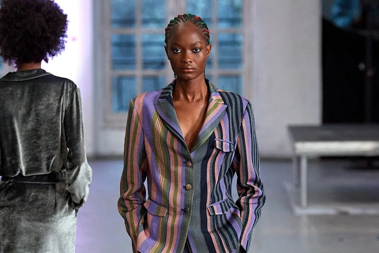 Kenneth Ize, Fall 2022 ready-to-wear collection. Here, the designer incorporates striped aso-oke fabric, which traces its roots to Yorubaland in the 15th century.