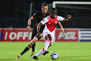 Thato Mokeke of Cape Town Spurs breaks away from Sedwyn
George of Royal AM during their DStv Premiership match on Tuesday. 