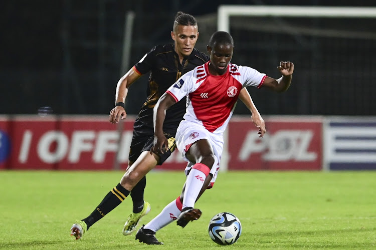 Thato Mokeke of Cape Town Spurs breaks away from Sedwyn George of Royal AM during their DStv Premiership match on Tuesday.