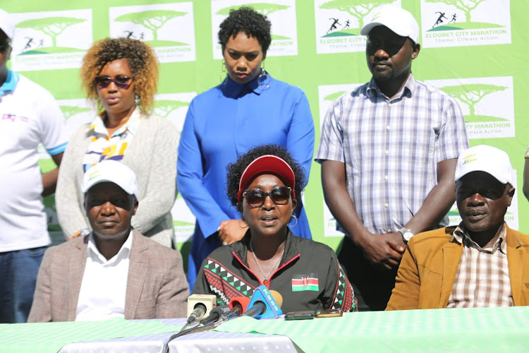 From left: Eldoret City Marathon race director Moses Tanui, race patron Gladys Boss and Uasin Gichu Athletics Kenya chairman Joseph Boit during a press conference in Eldoret