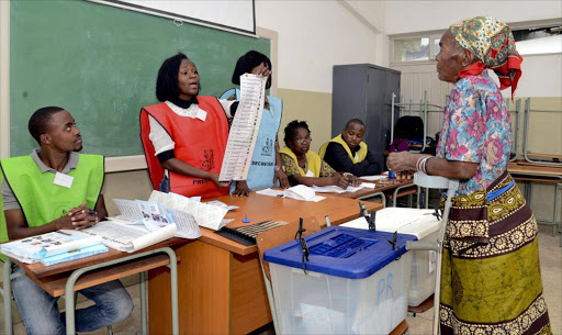 An elderly woman casts her vote at a polling station in Maputo, Mozambique. Picture Credit: EPA