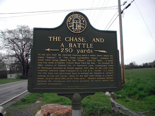 250 yards To the left over the railroad crossing stood a water tower where the famed "General", of "The Great Locomotive Chase" stopped for water while being chased by the "Texas", April 12, 1862....