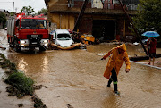 A fireman works on a road flooded due to the impact of storm Daniel in the city of Volos, Greece, September 6, 2023.  