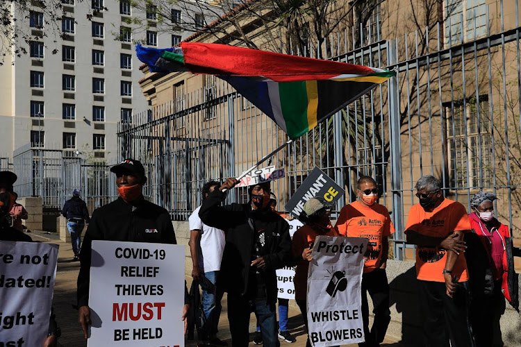 A group of protesters outside the Johannesburg court where six suspects were appearing in connection with the murder of Gauteng health department whistleblower Babita Deokaran.
