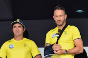 SA senior men's national cricket team captain Faf du Plessis (R) looks on during the rain delayed start of the 4th ODI between Sri Lanka and the Proteas at Pallekele International Cricket Stadium on August 08, 2018 in Pallekele, Sri Lanka. 
