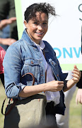 The south-easter played havoc with the Duchess of Sussex's hair-do at Monwabisi Beach in Cape Town on September 24 2019.