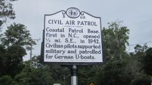 Coastal Patrol Base, first in N.C., opened ½ mi. S.E., in 1942. Civilian pilots supported military and patrolled for German U-boats.Plaque via North Carolina Highway Historical Marker Program, and...