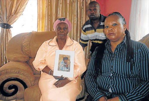 SIDELINED: Batandwa Ndondo's mother Lulama Sidumo, brother Viwe and sister Busisiwe Picture: ABONGILE MGAQELWA