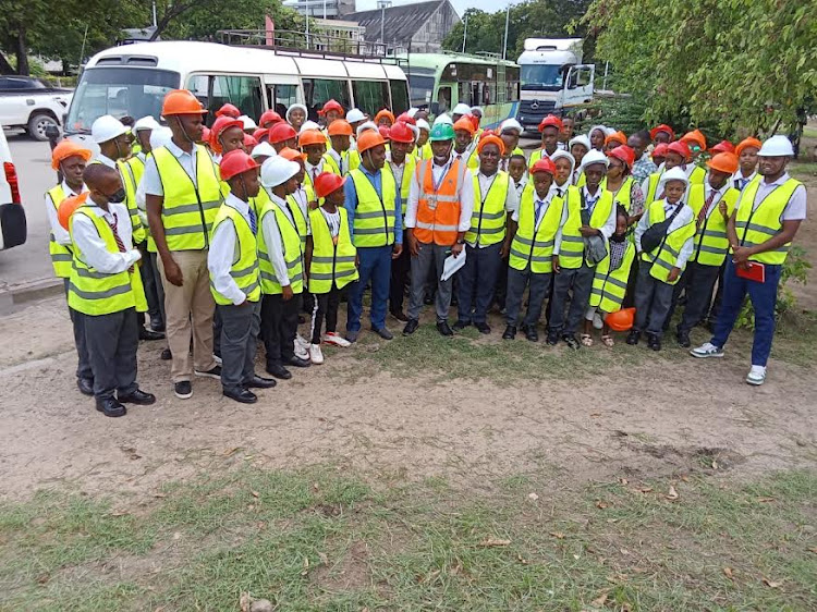 Pioneer School students together with Kenya Ports Authority officials pose for a photo at the Mombasa Port.
