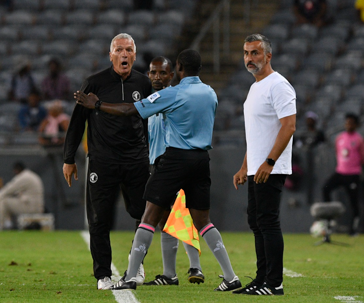 Cape Town Spurs coach Ernst Middendorp argues with a referee during their DStv Premiership match against Orlando Pirates at Orlando Stadium.