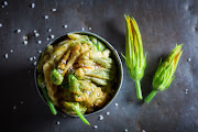 Stuffed zucchini flowers may seem posher than chicken nuggets but they're essentially both deep-fried foods.