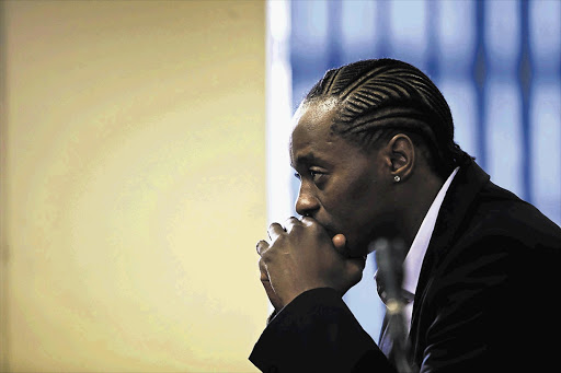 Molemo 'Jub Jub' Maarohanye listens as magistrate Brian Nemavhidi reads out his judgment in the Protea Magistrate's Court, Soweto. The hip-hop artist was found guilty and sentenced to 24 years in prision for killing four children during a drag race.