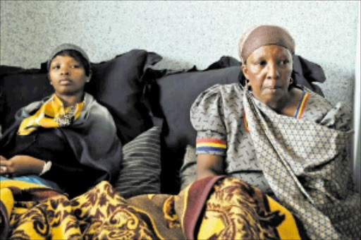 DEVASTATED: Mduduzi Gumede's wife Given Somwahle and her mother-in- law Cybil Ngubane. Gumede was allegedly tortured to death at the Douglasdale police station in Joburg. Pic. Peter Mogaki. 21/12/2009. © Sowetan. 20091221PMO:Given Somwahle (wife) and the mother in law Cybil Ngubane of Meadowlands Soweto who's son Mduduzi Gumede was tortured to death at Douglassdale police cell, Johannesburg.PHOTO:PETER MOGAKI
