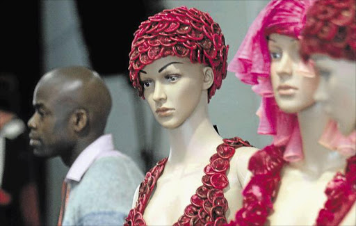 FRENCH LETTER FASHION: Mannequins display clothing made from condoms during the International Aids Conference in Durban. Picture: KEVIN SUTHERLAND/EPA