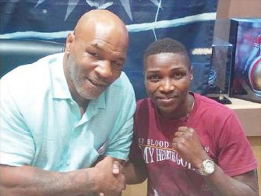 Fatuma Zarika with legendary boxer Mike Tyson during a recent meeting. /COURTESY