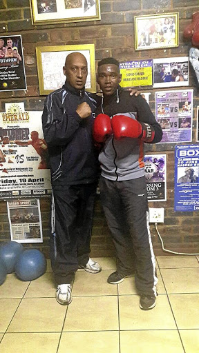 WBF All Africa junior flyweight boxing champion Mpho Seforo, right, and his new trainer Bernie Pailman.