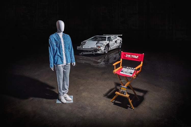 Included with the car are a Jordan Belfort costume featured in the Hero Car scenes, a director’s chair and autographed clapboard. Picture: SUPPLIED