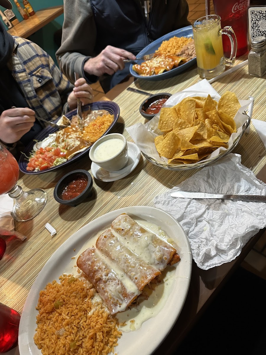 Three chicken enchiladas and rice gluten free, other meals pictured were not gluten free