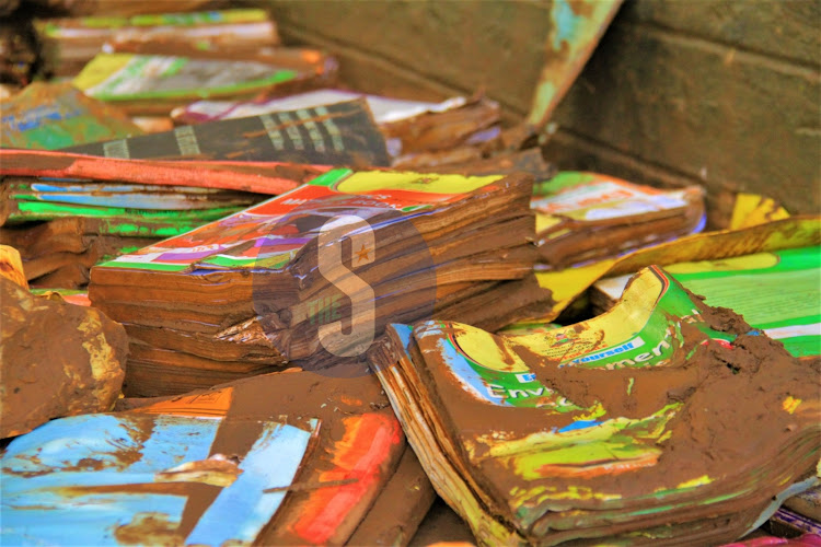 Smudged books inside a muddy classroom at Mathare North Primary School affected by floods, May 3, 2024.