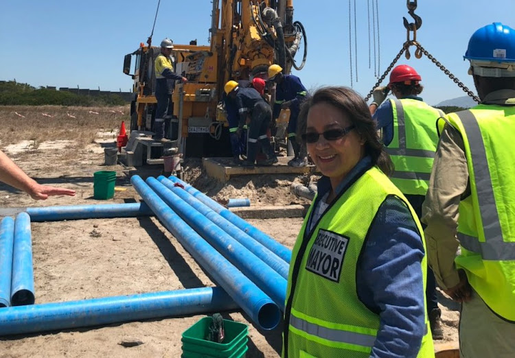 Cape Town mayor Patricia de Lille with a drill tapping the Cape Flats aquifer in Mitchells Plain.