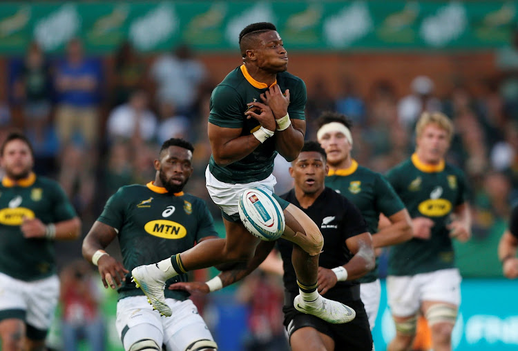 South Africa's Aphiwe Dyantyi collects the high ball during the Rugby Championship match between the Springboks and the All Blacks at Loftus Versfeld in Pretoria on October 6, 2018