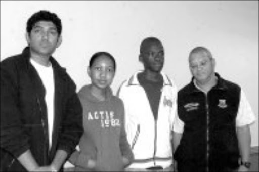 BRIGHT SPARKS: The Grade 12pupils who obtained six distinctions each. From left, Robin Mathew, 18, Nshalati Mashao, 17, and Amukelani Maluleke, 18, with principal Hein Weber, from Khanyisa Education Centre in Giyani, Limpopo. Pic. Elijar Mushiana. 01/2008. © Sowetan.