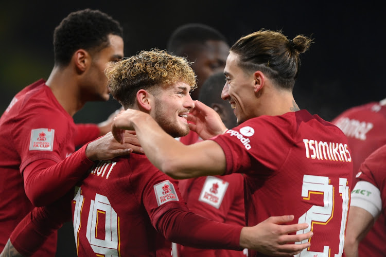 Harvey Elliott of Liverpool celebrates with teammates after scoring in their the FA Cup third round replay match against Wolverhampton Wanderers at Molineux in Wolverhampton on January 17 2023.