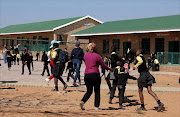 Parents call pupils at Ntji Mothapo Primary School in Limpopo to  their classrooms after they   forcefully removed the teachers who were against the installation of CCTV cameras.  Photo: SANDILE NDLOVU