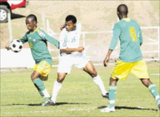 Nigeria player Uche Ikechukwu and South Africa player Teko Modise with Sibonoso Gaxa looking\n06 Sepetember 2008,\nSouth Africa v Nigeria, AFCON Qualifier Match, EPRU Stadium, Port Ellizabeth, RSA,\nCredit:Abbey Sebetha / Eagency\n\nBREAKAWAY: Bafana Bafana midfielder Teko Modise, left, wins the tussle for the ball against Nigeria player Uche Ikechukwu as Siboniso Gaxa, right, looks on in the Africa Cup of Nations qualifying match in Port Elizabeth on Saturday.