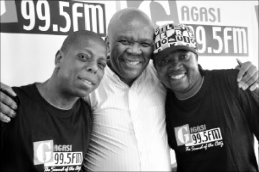 upbeat: New iGagasi FM DJ Vusi Letsoalo, station programme manager Patrick Bogatso and Archie Majola, also a new DJ at the station.Pic. THULI DLAMINI. 23/02/2010. © Sowetan.