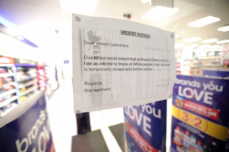 A notice at the entrance to the Clicks store in Goodwood Mall, Cape Town, where members of the EFF protested about the 'racist' advert for hair products.