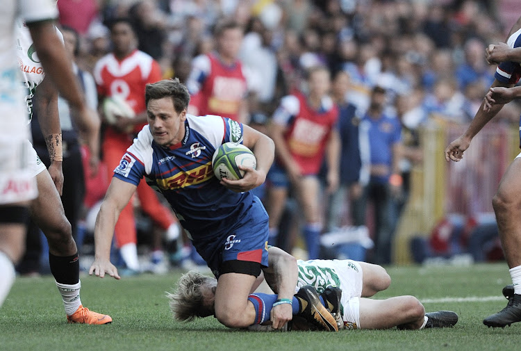 The DHL Stormers SP Marais tries to get away from a tackle during the Super Rugby game against the Chiefs at Newlands Rugby Stadium, Cape Town on May 12 2018.