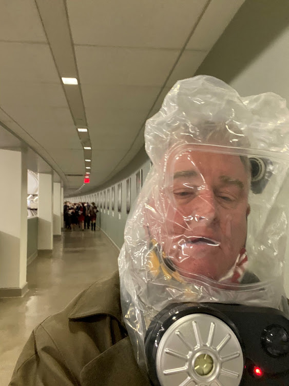 Congressman David Trone wears a gas mask inside the US Capitol in Washington, DC, on January 6, 2021, in this still image obtained from social media