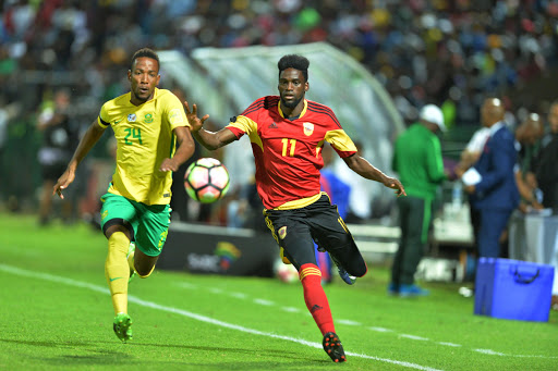 Diamond Thopola of SA and David Manuel of Angola during the International friendly match between South Africa and Angola at Buffalo City Stadium on March 28, 2017 in East London, South Africa.