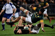 South Africa's Warren Whiteley (top) dives over the top of New Zealand's Ben Smith durin the rugby Test match between New Zealand and South Africa at AMI Stadium in Christchurch on September 17, 2016. File photo