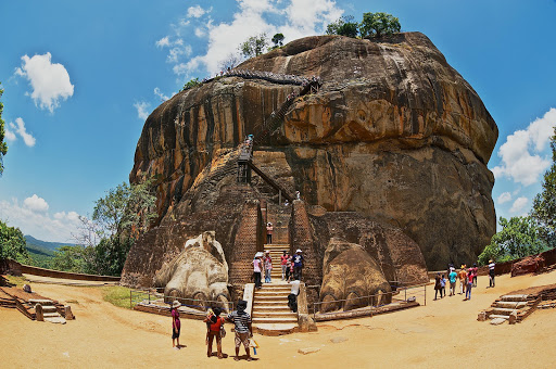 Tourists climb Sigiriya Lion rock fortress in Sigiriya, Sri Lanka.