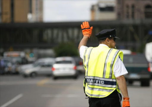 Traffic officer knocked over by speeding car