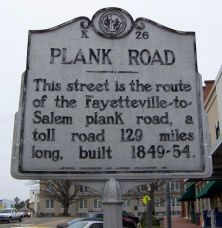 This street is the route of the Fayetteville-to-Salem plank road, a toll road 129 miles long, built 1849-54.Plaque via North Carolina Highway Historical Marker Program, and is used with their...