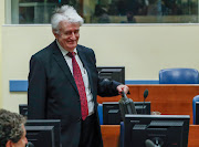 Former Bosnian Serb leader Radovan Karadzic appears in a courtroom before the International Residual Mechanism for Criminal Tribunals (MICT), which is handling outstanding war crimes cases for the Balkans and Rwanda, in The Hague, Netherlands, April 23, 2018. 