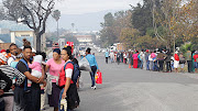 People queuing for food and clothing parcels in Knysna 
