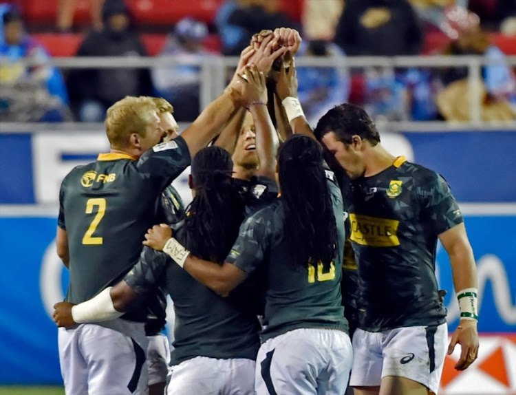South Africa huddles up before their match against Australia during day 2 of the 2018 HSBC USA Sevens at Sam Boyd Stadium on March 03, 2018 in Las Vegas, United States of America.