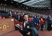 Manchester United's Dutch manager Louis van Gaal arrives ahead of the English Premier League football match between Manchester United and Chelsea at Old Trafford in Manchester, north west England, on October 26, 2014. Louis van Gaall will go after Kevin Strootman, Diego Godin, Mats Hummels and Nathaniel Clyne in the summer after the Manchester United manager was handed a £100 million to spend on Old Trafford targets.