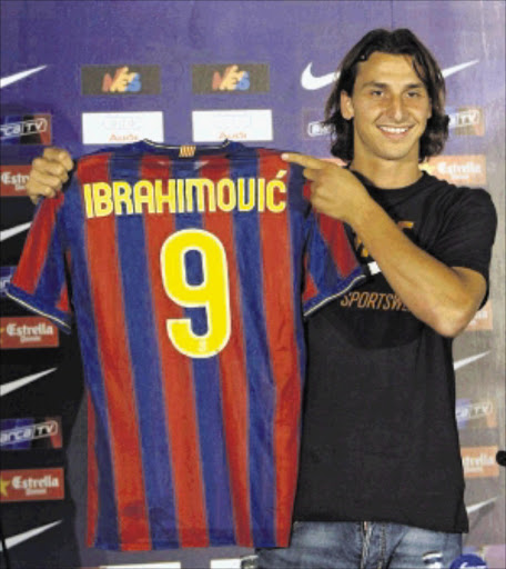 HAS HAD ENOUGH: Zlatan Ibrahimovic.Barcelona's new signing Zlatan Ibrahimovic of Sweden holds up his FC Barcelona jersey as he was presented at the Camp Nou stadium in Barcelona, July 27, 2009. Inter have agreed to swap the Swedish international for Samuel Eto'o plus cash and the Spanish club said they had given permission for the Cameroon striker to have a medical in Milan, along with Aleksandr Hleb. REUTERS/Gustau Nacarino (SPAIN SPORT SOCCER)