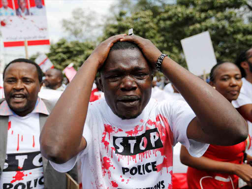 A member of the civil society cries during a protest dubbed "Stop extrajudicial killings" on the killing of human rights lawyer, Willie Kimani, his client and their driver in Nairobi, Kenya, July 4, 2016. /REUTERS