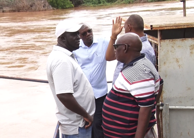 Garissa County Commssioner Mohamed Mwabzo,GAWASCO MD Mohamed Dolal and other officials accessing the Garissa main intake plant.