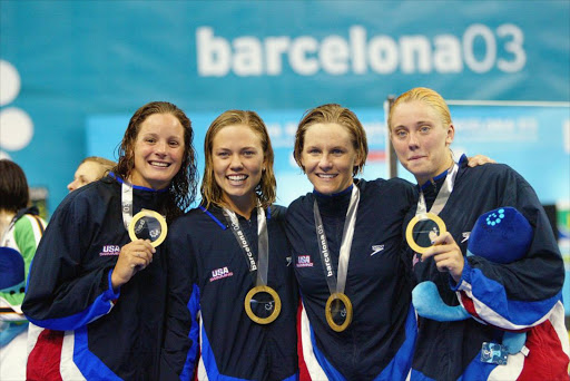 Lindsay Banko, Natalie Coughlin, Jenny Thompson, and Rhi Jeffrey pose for a picture with their gold medals after winning the 4x100m freestyle final, during the 2003 FINA World Swimming Championships at Palau Sant Jordi Sports Palace on July 20, 2003 in Barcelona, Spain